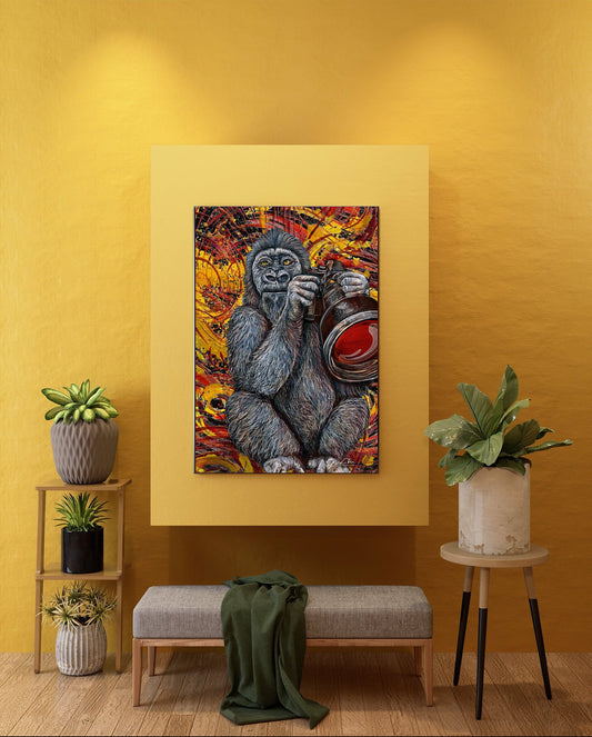 A framed wall art print showing a stylized gorilla painting in warm orange, red, yellow, and blue tones, displayed on a mustard yellow wall above a bench with plants and side tables in a staged interior. Gorilla Cam bob Doug LaRue