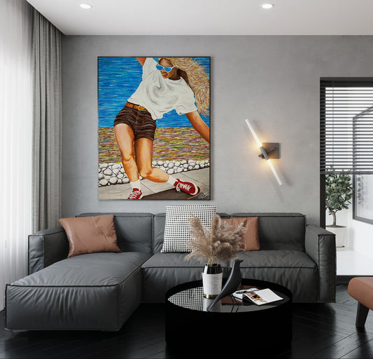 Modern living room with a gray sofa, coffee table, and decorative painting on the wall. Woman skateboarding by a colorful beach scene Girls Like You is an acrylic painting by Doug LaRue • Woman skateboarding on a wooden deck with a colorful abstract oceanside beach path