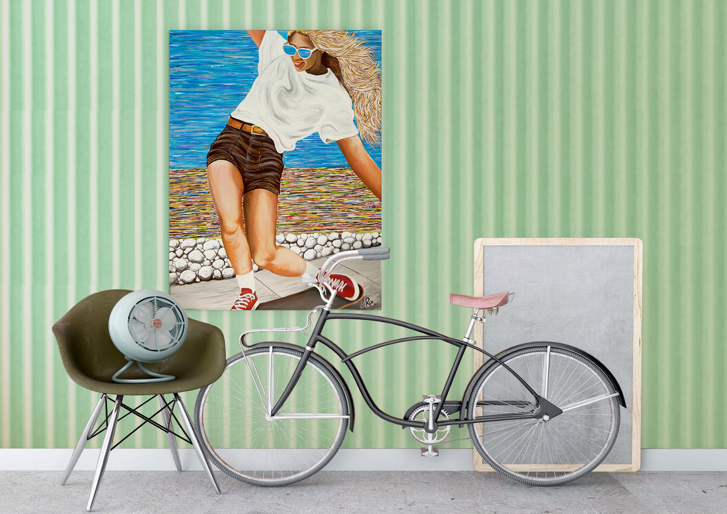 Bicycle leaning against a wall with a framed picture of a woman on a beach. a colorful abstract oceanside beach path