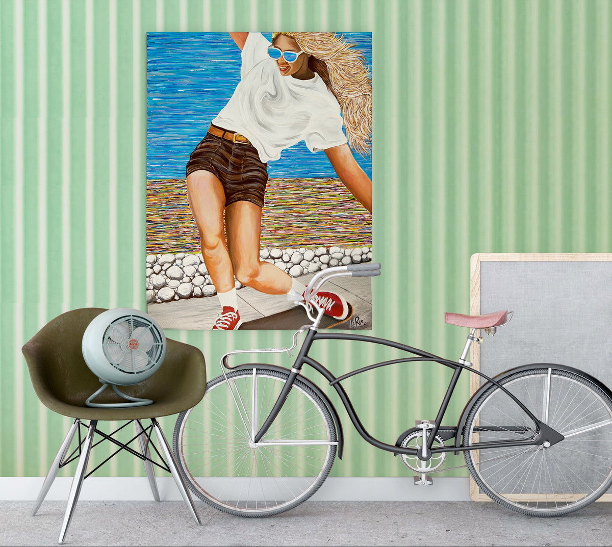 Bicycle leaning against a wall with a framed picture of a woman on a beach. a colorful abstract oceanside beach path