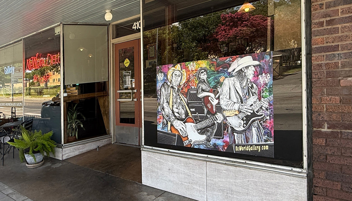 A colorful painted mural of three guitarists is displayed on a large storefront window of a restaurant or bar, with the sidewalk, brick wall, and store entrance visible around it.