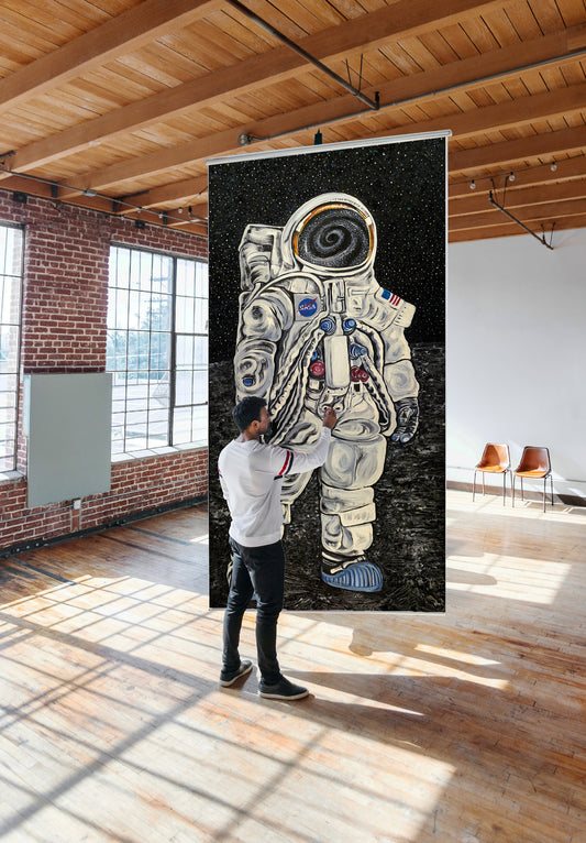 Quantum Astronaut by Doug LaRue hanging from the ceiling of a gallery