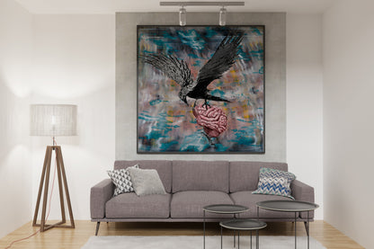 Living room with a gray sofa, abstract painting on the wall called Bird Brain by Doug LaRue, and decorative items. 