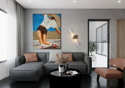 Modern living room with a gray sofa, coffee table, and decorative painting on the wall. Woman skateboarding by a colorful beach scene Girls Like You is an acrylic painting by Doug LaRue • Woman skateboarding on a wooden deck with a colorful abstract oceanside beach path