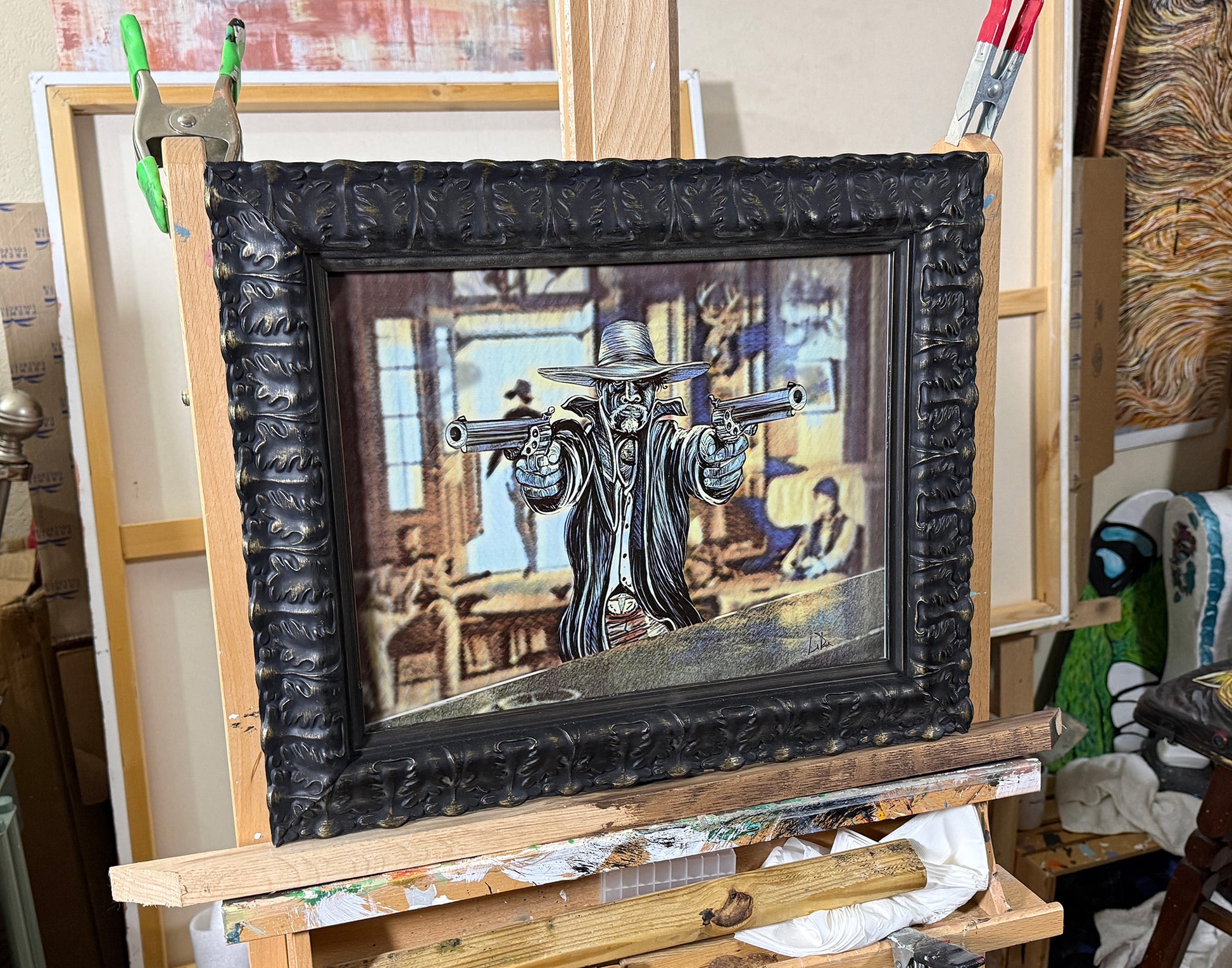 HOMBRE Framed artwork on an easel with a detailed black frame
