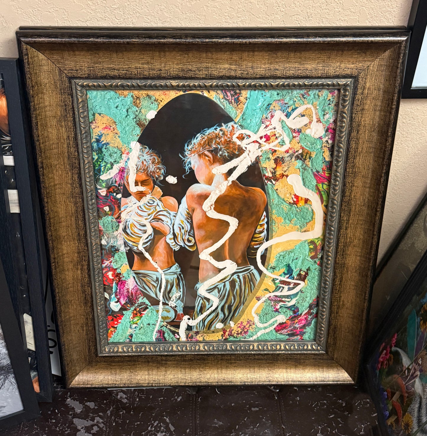 Framed artwork with abstract design and figures on a colorful background. Hyde Park Portal Surfer by Doug LaRue