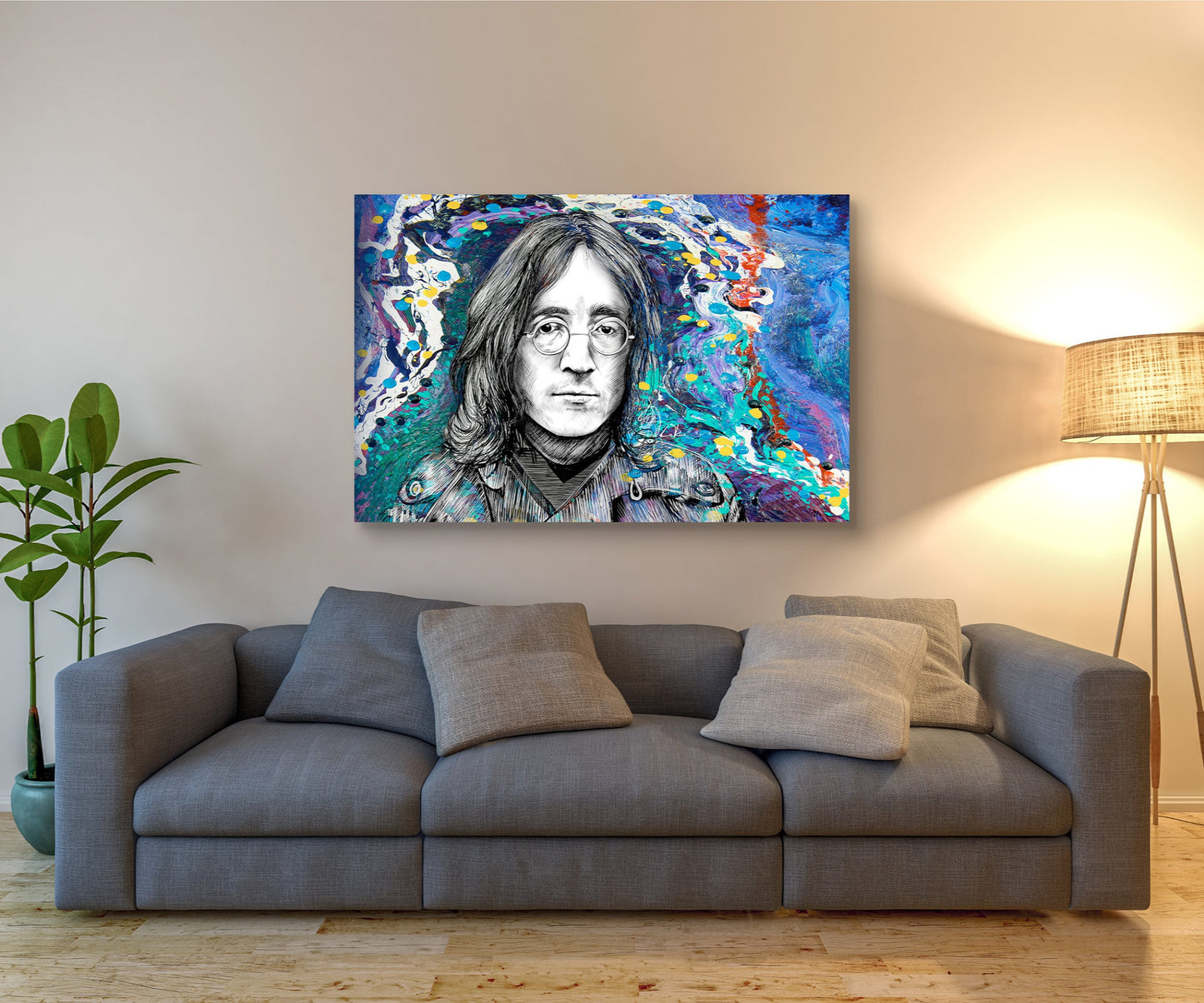 Gray sofa with a colorful portrait of a famous figure on the wall above it. John Lennon 