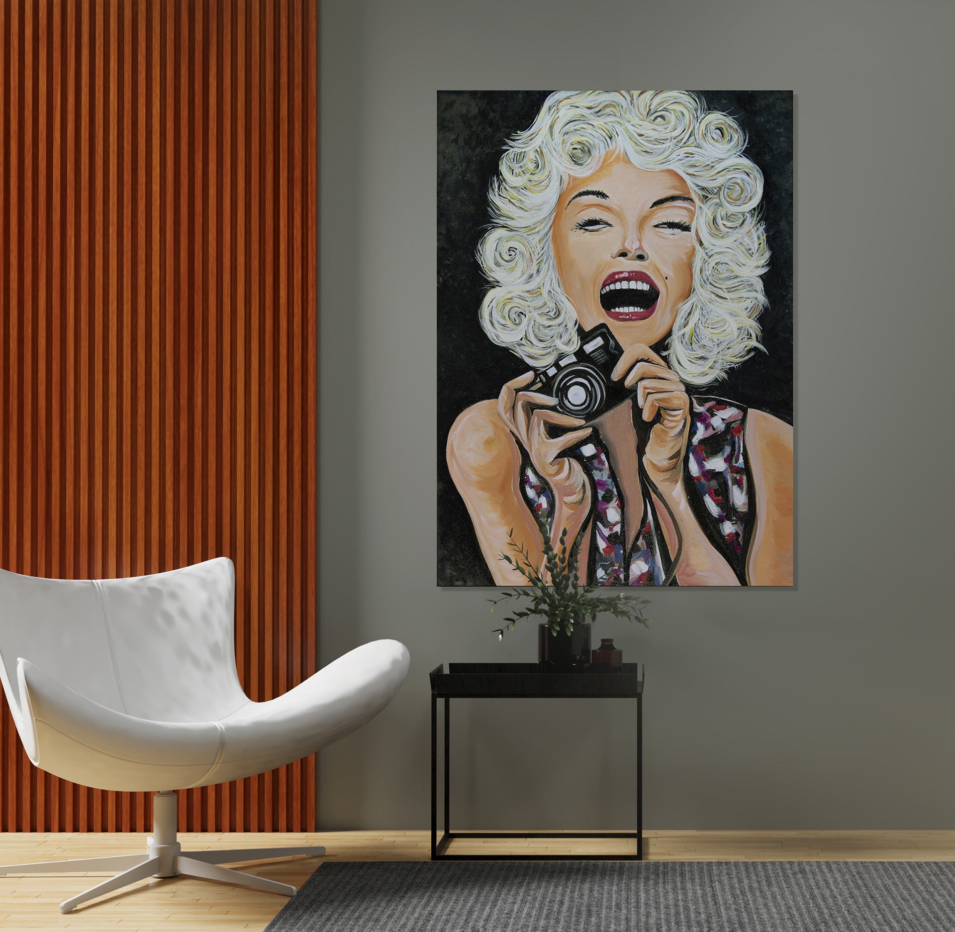 Marilyn Monroe portrait in oil on canvas on a wall near a modern white leather chair by Doug LaRue