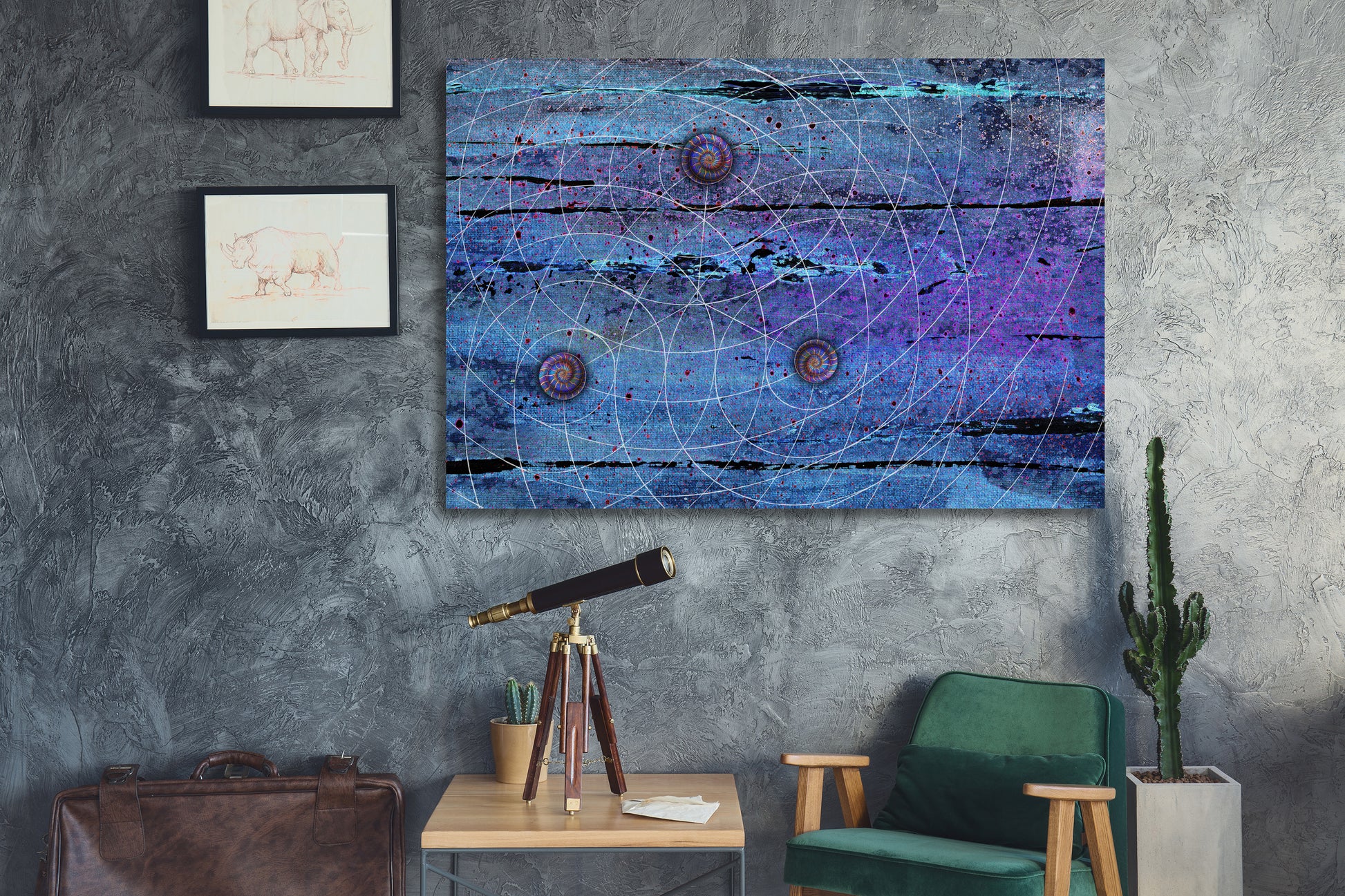 A square abstract wall art print featuring a blue and purple cosmic design with white geometric lines and circular motifs, displayed on a textured gray wall in a styled room setting with a green chair, side table, and cactus. Blue Trinity by Doug LaRue