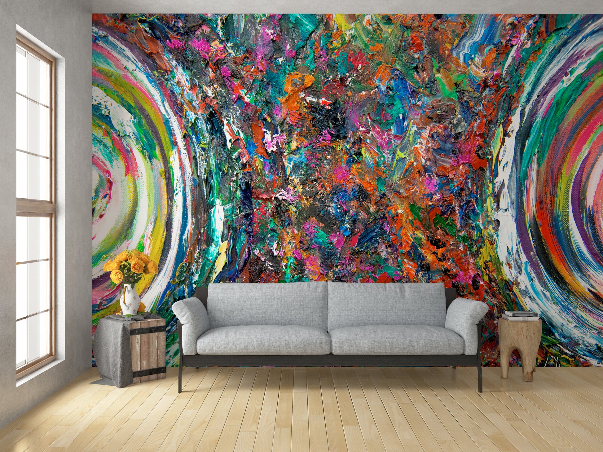 Living room with a colorful abstract wall mural and a gray sofa. Entanglement by Doug LaRue