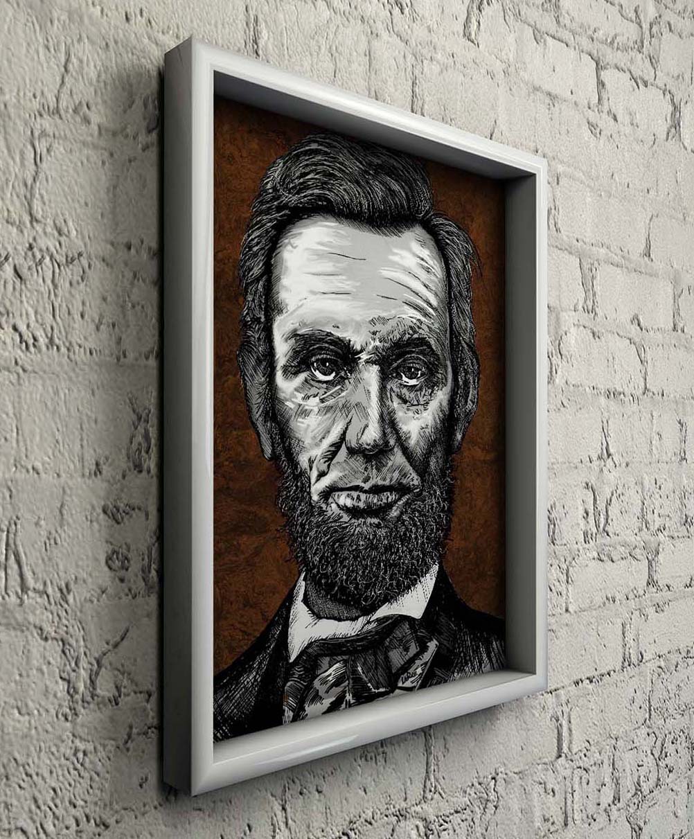Ink portrait of President Abraham Lincoln on a white brick wall in a white woodl frame