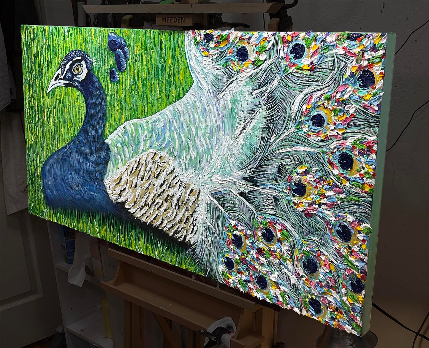 Frida Kahlo's Peacock art by Doug LaRue angled on an easel to show the thick impasto on the tail